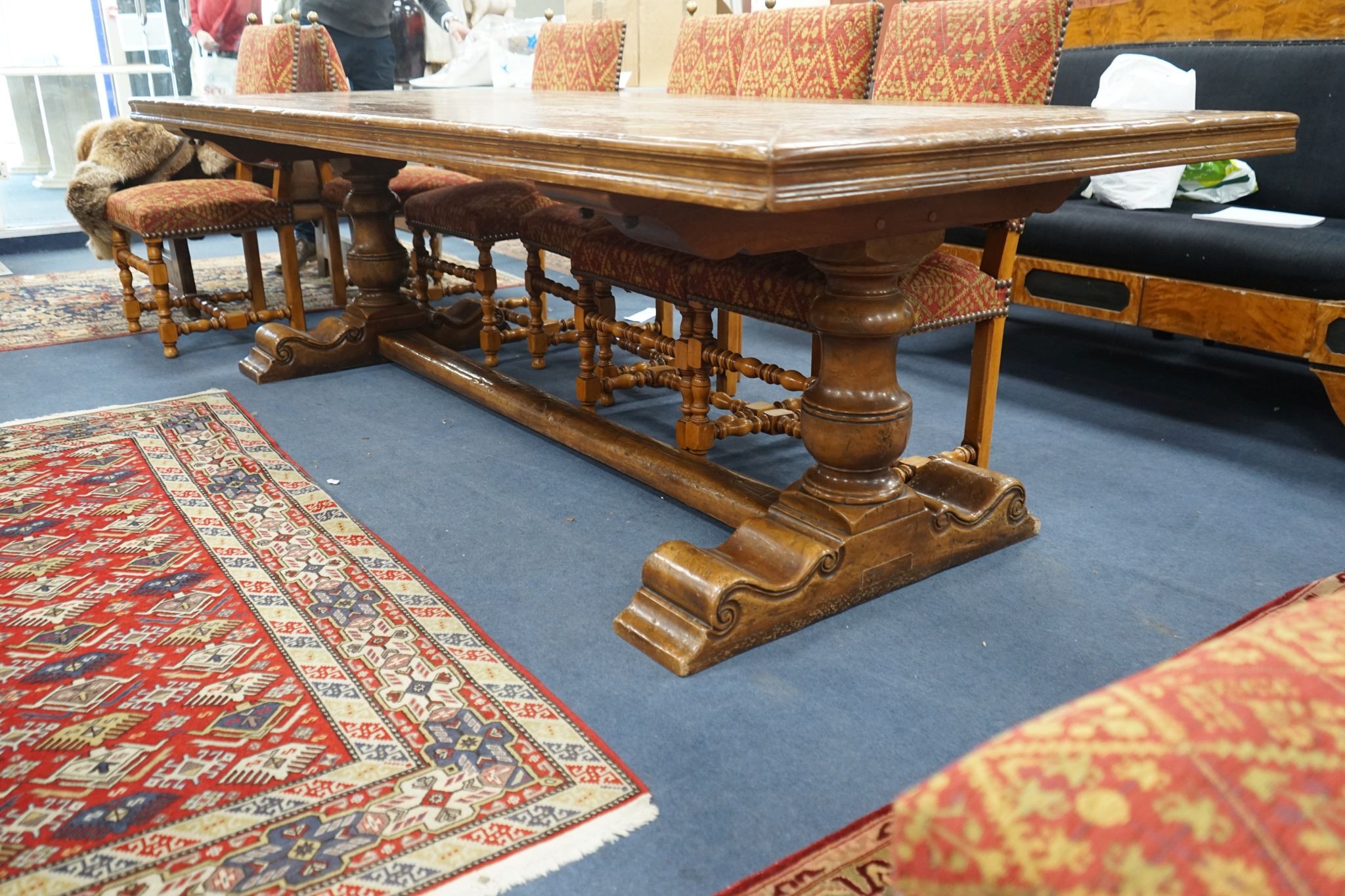 An 18th century style rectangular walnut refectory dining table on baluster end supports with central stretcher, length 270cm, width 106cm, height 76cm